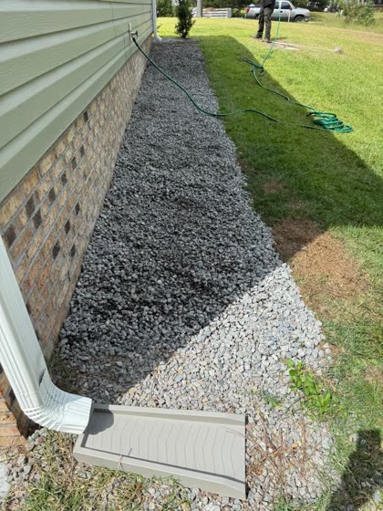 Gravel drain line catching a downspout