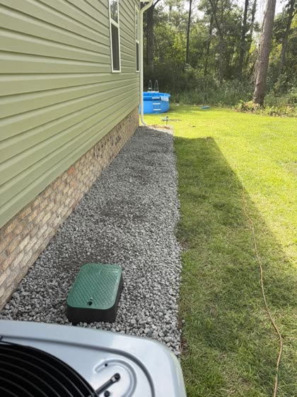 Gravel strip along a home at the AC unit