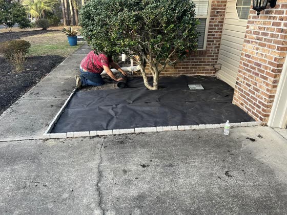 Landscape fabric laid before the rock goes down