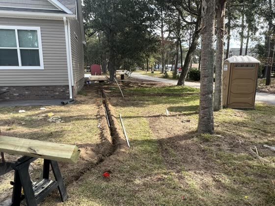 String lines set for a new install beside a home