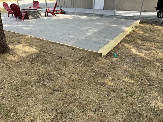 Paver patio with red chairs