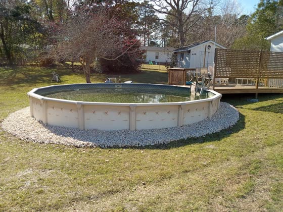 Rock ring around a backyard pool