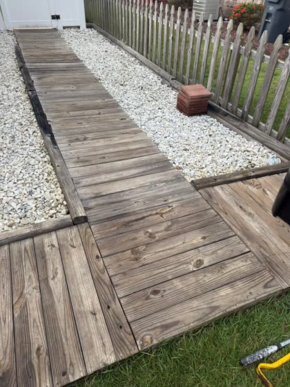Wood walkway framed in white rock